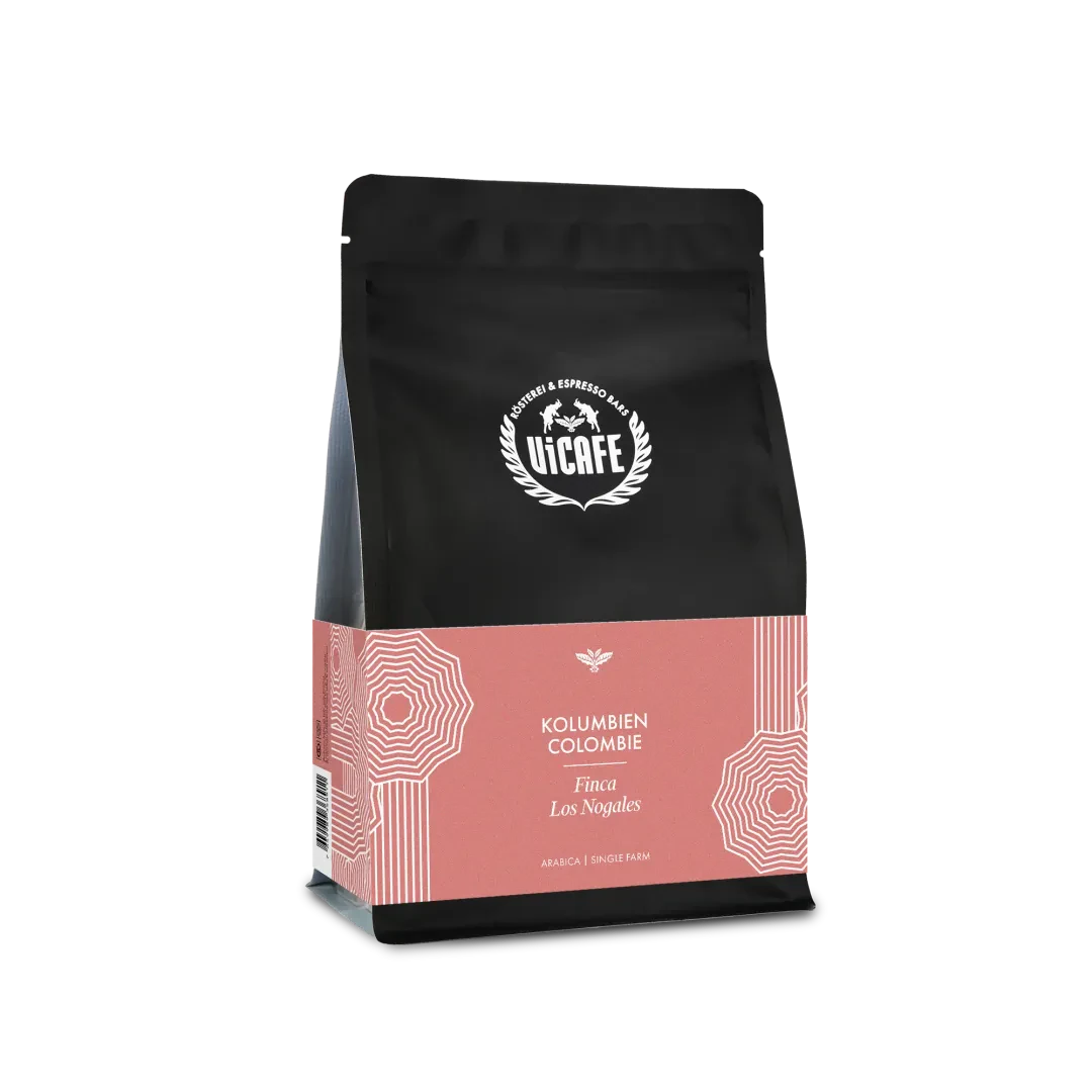 ViCAFE Kolumbien Finca Los Nogales Spezialitätenkaffee in schwarzer Packung mit rosanem Etikett