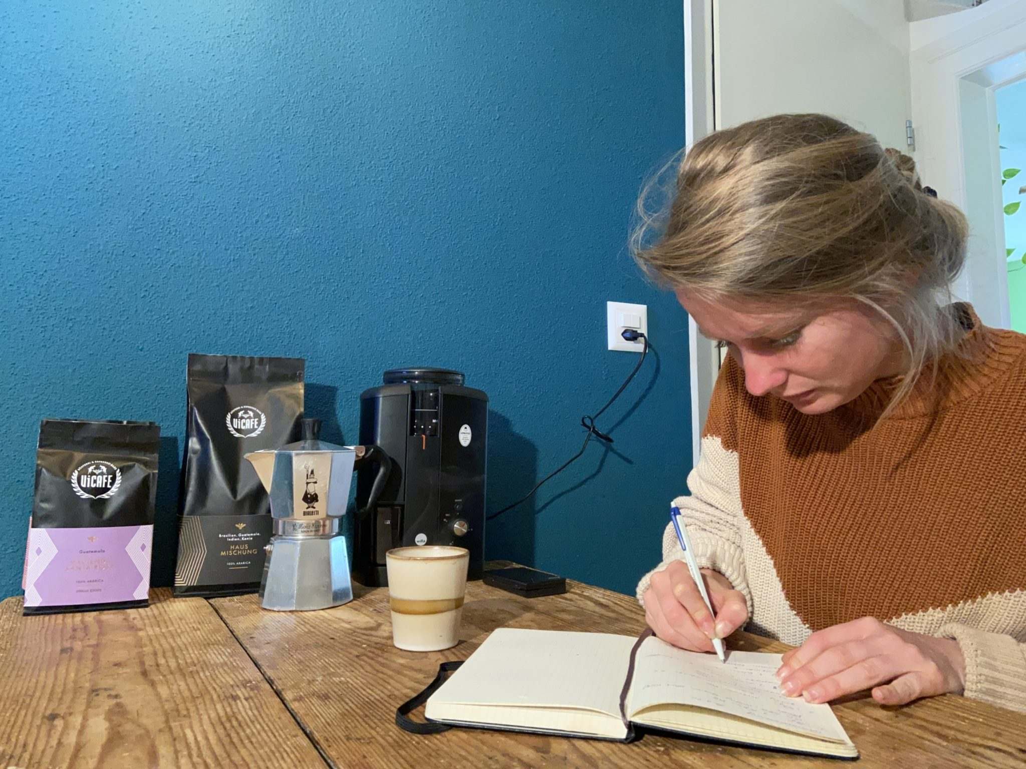 barista taking notes to brew the best coffee